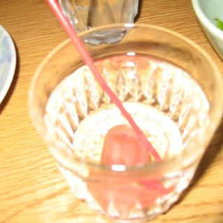 Refreshing Cocktail in a Glass with Straw