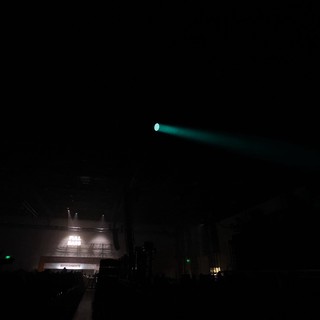 Cyan Laser Beam Cuts Through Dark Festival Night