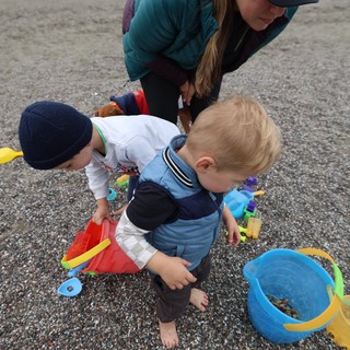 Toddlers Exploring Pebble Beach with Mom