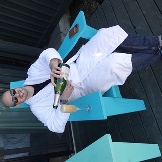 Relaxing with Champagne in White Bathrobe