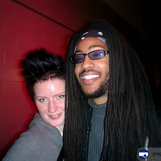 Urban Portrait with Smiling Couple and Dreadlocked Man