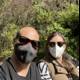 Two People Enjoying Nature while Wearing Masks in the Park