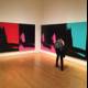 Man Contemplates Modern Art in Art Gallery
