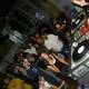 Nightclub DJ Entertains a Crowded Room