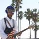 Turbaned Guitarist Serenades Under the Palm Trees