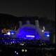 Blue-Lit Explosion: A Vibrant Concert Crowd