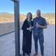 A Portrait of Two People Standing on a Patio in Santa Fe