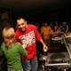 Green-shirted DJ spins tunes at nightclub
