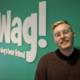 A Stylish Man Sporting Glasses and a WAG Logo