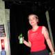 Woman with Beer Bottle at a Show