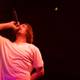 Aesop Rock Takes the Stage with Microphone in Hand