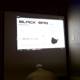 Man Engrossed in Screen at Defcon 22 Seminar
