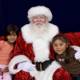 Santa Claus and Two Children on Red Couch