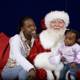 Santa Claus Spreads Joy to Mother and Child