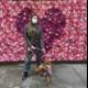Masked Woman and her Flowered Furry Friend
