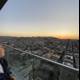 Urban sunset selfie from a San Francisco balcony
