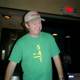 Randy J sporting green T-shirt and baseball cap
