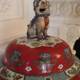 Ceramic Dog Figurine on Red and White Pottery Dish