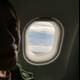 A Woman's Plane Window View