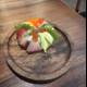 Savor the Flavors of Fresh Sushi on a Wooden Plate