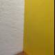 Vibrant Yellow Plywood Wall