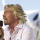Richard Branson Takes the Stage with Microphone