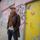 Junkie XL poses in front of urban art