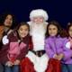 Santa Claus Spreading Joy to Children at APC Xmas Party