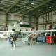 Helicopter Amongst the Aircraft in Hangar