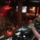 DJ spinning at crowded night club