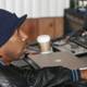 Black Jacketed Man Typing Away