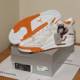 Orange and White Sneakers on a Box