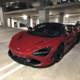 Red McLaren Coupe in Parking Garage