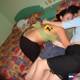 Three Women Embrace on a Cozy Ensenada Bed