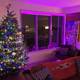 Purple Glowing Christmas Tree in a Festive Living Room