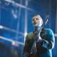 Win Butler Rocks the Stage with his Electric Guitar