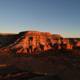Sun sets over red rock formations