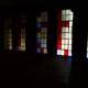 Colorful Stained Glass Windows In a Dark Room