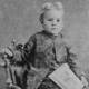 Vintage Portrait of Young Boy Sitting on Chair