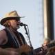 Willie Nelson strums the guitar at Coachella