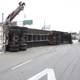 Overturned truck lifted by crane