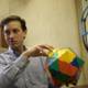 Colorful sphere held by man