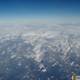 Majestic Snowy Mountains From An Airplane Window