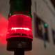 Red Traffic Light Illuminates Wall