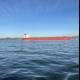 Red Cargo Ship Sailing Across San Francisco Bay